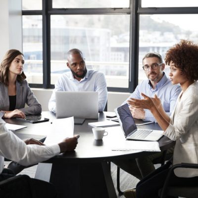 Millennial black businesswoman addressing colleagues at a corporate business meeting, close up xtraglobex marketing meeting